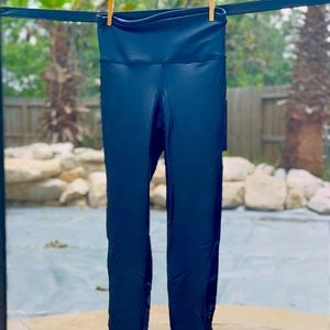 Black boutique leggings with mesh.